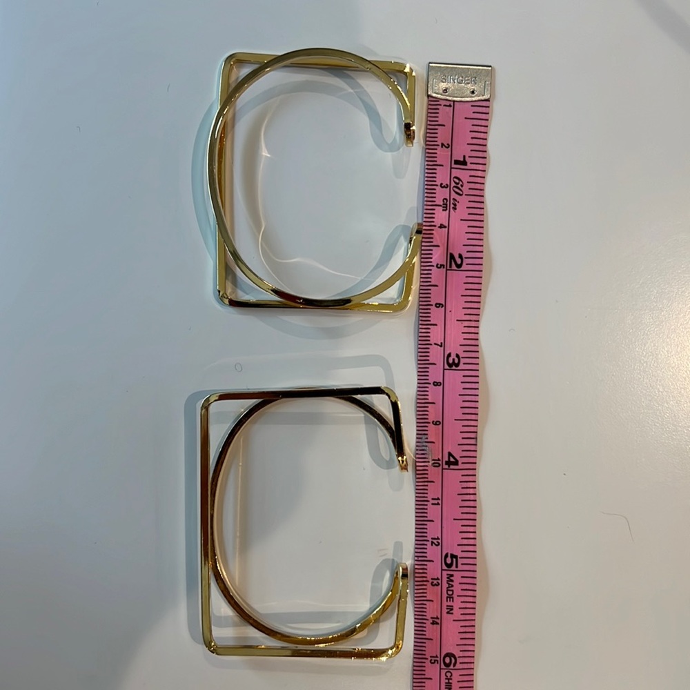 Gold colored geometric bangles